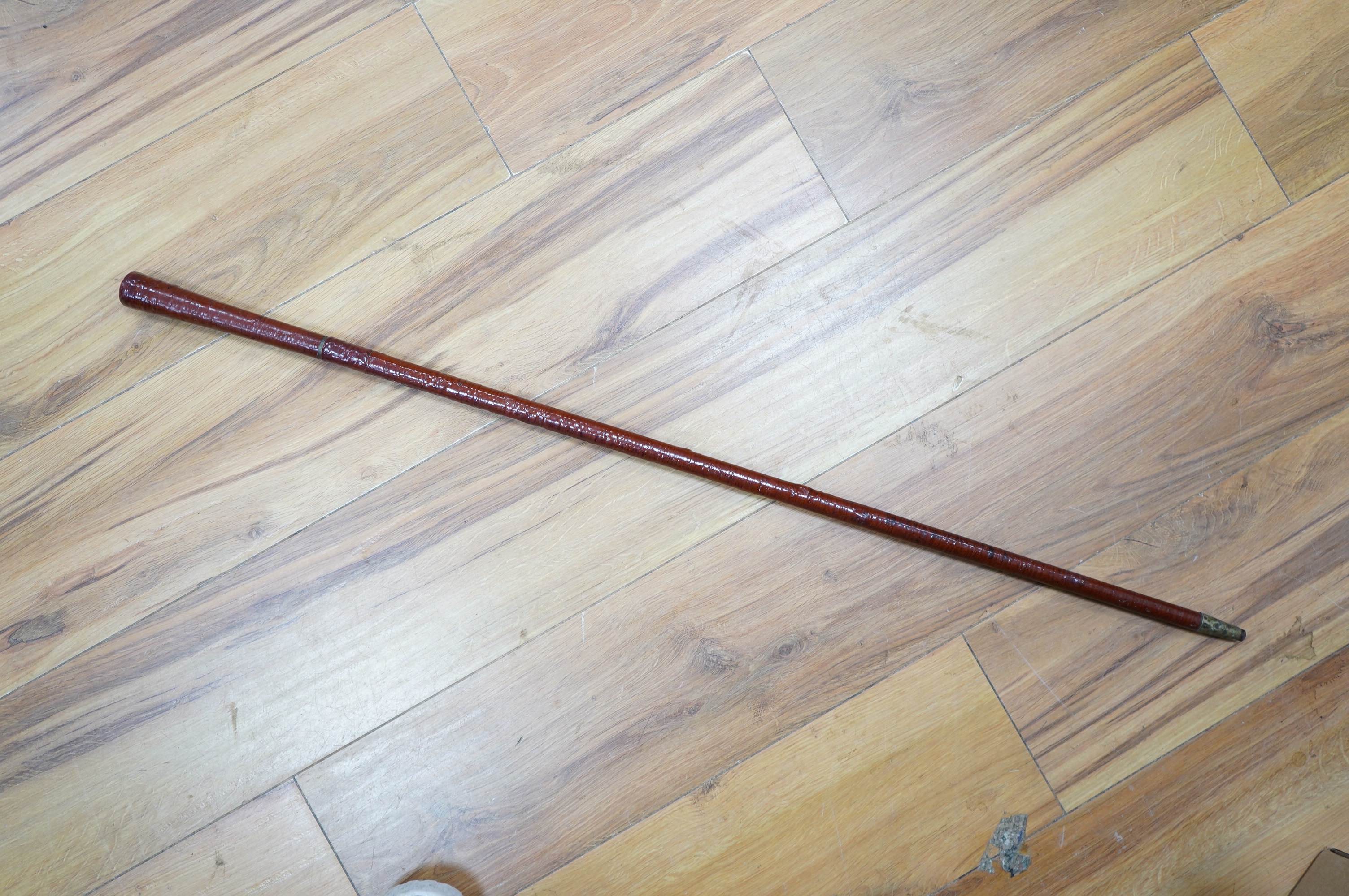 An Edwardian leather covered swordstick with ivory serpent to the shaft, blade 45cm, overall length 89cm. Condition fair to good, minor losses to leather work. CITES Submission reference, CKA5P6DV